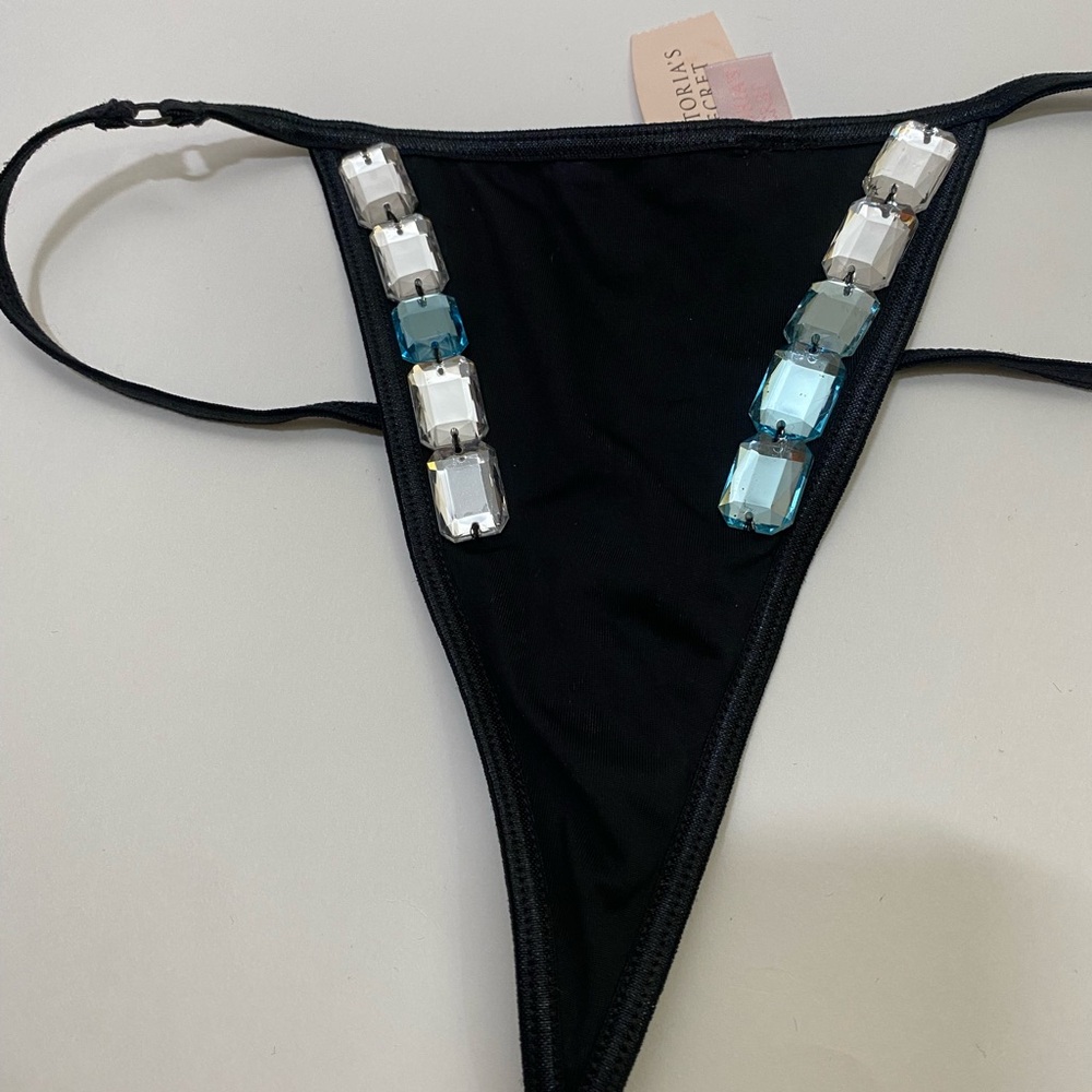 Victoria's Secret Black Thong with clear and aqua stones.  Very nice !